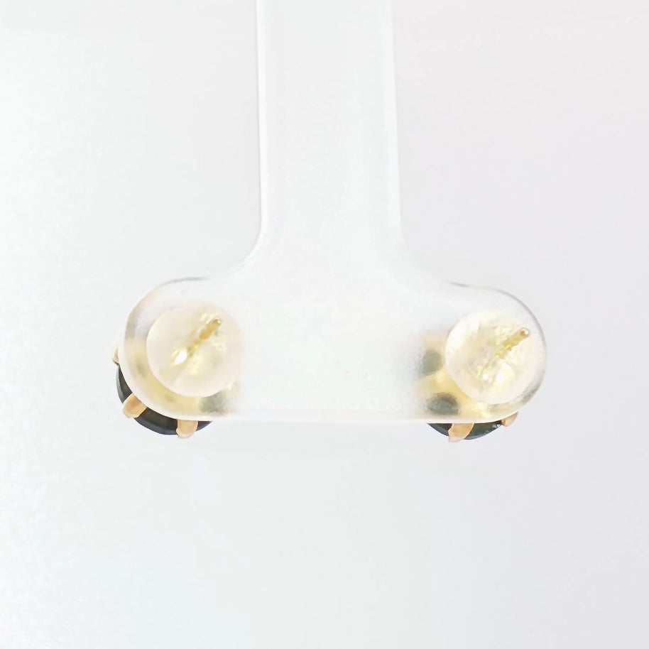 Luxury yellow gold earrings featuring natural black diamonds