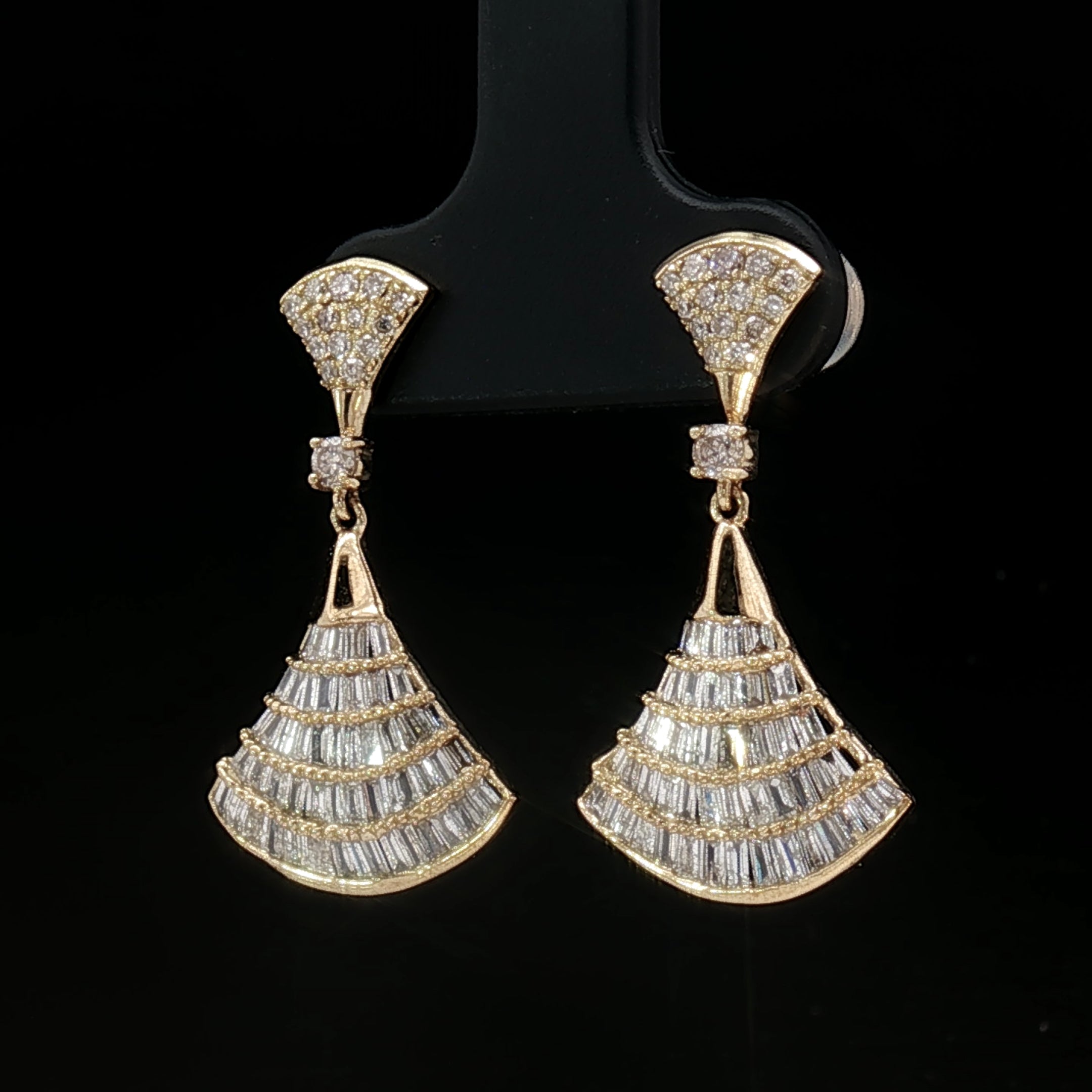 Side view of diamond dangle earrings in 18k yellow gold showing craftsmanship