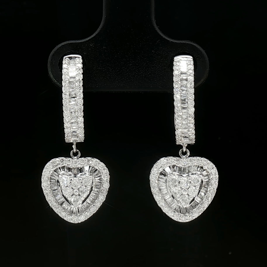 Side view of white gold diamond dangle earrings showing exquisite craftsmanship