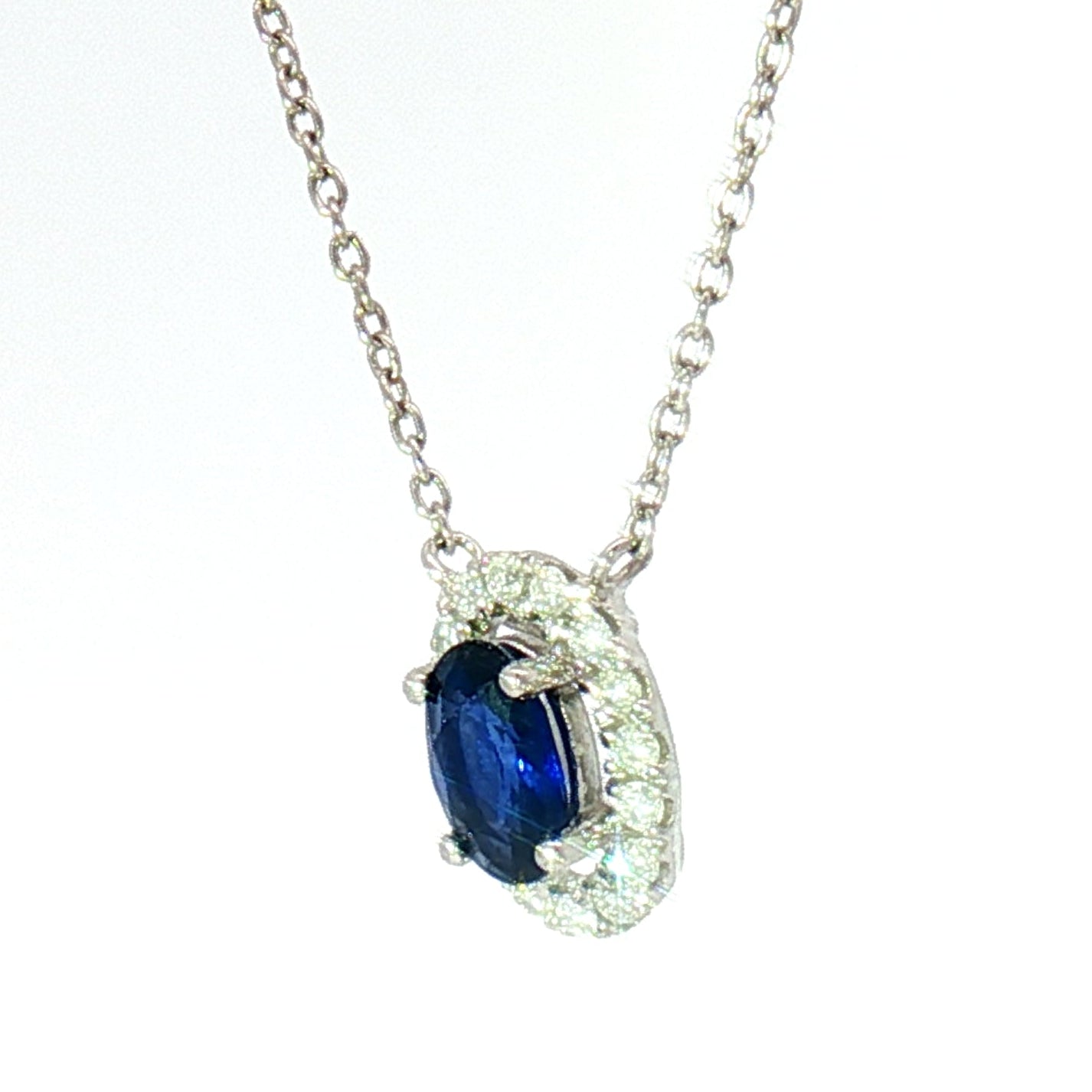 18k White Gold Charm Halo Necklace with 0.57ct Blue Sapphire and 0.11 tcw Natural Diamond