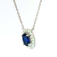 18k White Gold Charm Halo Necklace with 0.57ct Blue Sapphire and 0.11 tcw Natural Diamond